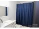 Bathroom showcasing a new vanity with black fixtures, and a blue shower curtain at 149 Glenwood Dr, Rock Hill, SC 29732