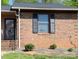 Brick townhouse exterior with dark shutters, a brown roof, and a dark-trimmed front door at 149 Glenwood Dr, Rock Hill, SC 29732