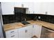 Modern kitchen showcasing white cabinets, wood countertops, and subway tile backsplash at 149 Glenwood Dr, Rock Hill, SC 29732