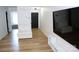 Open floor plan showcasing living room, front door, and bedroom access with laminate flooring at 149 Glenwood Dr, Rock Hill, SC 29732