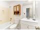 Traditional bathroom with tub and shower combo, vanity and mirrored medicine cabinet at 16320 Peach Grove Ln, Charlotte, NC 28277