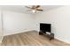 Bedroom with neutral walls, modern wood flooring, and a TV on a stand at 16320 Peach Grove Ln, Charlotte, NC 28277