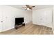 Spacious bedroom with wood floors and a ceiling fan to keep you cool and refreshed at 16320 Peach Grove Ln, Charlotte, NC 28277