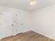 Bedroom with wood flooring and closet doors at 16320 Peach Grove Ln, Charlotte, NC 28277