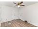 This bedroom features two closets and modern wood flooring at 16320 Peach Grove Ln, Charlotte, NC 28277