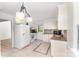 Efficient kitchen with tiled floors, granite counters, white cabinets, and mosaic backsplash at 16320 Peach Grove Ln, Charlotte, NC 28277