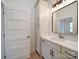 Bathroom boasts a vanity with modern hardware, stylish mirror, and plenty of storage at 1706 Ruben Rd, Monroe, NC 28112