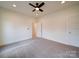A bedroom offering carpet flooring, ceiling fan, and multiple windows at 1706 Ruben Rd, Monroe, NC 28112