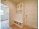 Convenient mudroom includes built-in storage and a door to the exterior at 1706 Ruben Rd, Monroe, NC 28112