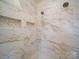 Luxurious shower with elegant tile work, rainfall showerhead, and built-in shelving at 1706 Ruben Rd, Monroe, NC 28112
