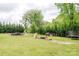 Expansive backyard with multiple amenities, including a pool and trampoline at 18 Shannon Ct, Newton, NC 28658