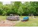 Serene backyard featuring a pool and a comfortable lounging area at 18 Shannon Ct, Newton, NC 28658