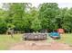 Lush backyard showcasing a pool, shed, and ample green space at 18 Shannon Ct, Newton, NC 28658