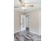 Bedroom featuring hardwood floors, an open door, a ceiling fan, and a closet with white doors at 18 Shannon Ct, Newton, NC 28658