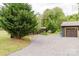 Long gravel driveway leading to the home's garage with a neatly maintained lawn on either side at 18 Shannon Ct, Newton, NC 28658