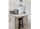 Stylish kitchen featuring a central island with seating, white cabinets, and modern lighting fixtures at 18 Shannon Ct, Newton, NC 28658