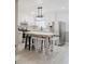 Bright kitchen with white cabinetry, stainless steel appliances, and a central island with seating at 18 Shannon Ct, Newton, NC 28658