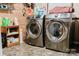 Well-equipped laundry area with modern washer and dryer and wood panel walls at 18 Shannon Ct, Newton, NC 28658