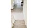 Carpeted stairway leads to a spacious room, bathed in natural light with neutral walls at 18 Shannon Ct, Newton, NC 28658