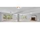 Finished basement featuring a brick fireplace and multiple windows at 1806 Asbury Hall Ct, Charlotte, NC 28209