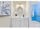 Charming bathroom with white vanity and colorful bathroom in the background at 1806 Asbury Hall Ct, Charlotte, NC 28209