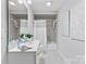 Bathroom with shower/tub combo, white vanity, and neutral-toned tile at 1806 Asbury Hall Ct, Charlotte, NC 28209