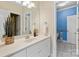Well-lit bathroom vanity with a view into the adjacent ' bathroom at 1806 Asbury Hall Ct, Charlotte, NC 28209