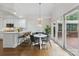 Bright breakfast nook features hardwood floors, and French doors to the deck at 1806 Asbury Hall Ct, Charlotte, NC 28209