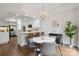 Bright dining area featuring a modern chandelier and stylish wallpaper next to the kitchen at 1806 Asbury Hall Ct, Charlotte, NC 28209