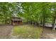 Quaint guest house nestled among mature trees, offering a private retreat for visitors and additional living space at 1806 Asbury Hall Ct, Charlotte, NC 28209