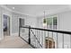 Hallway overlooking front door and featuring modern lighting at 1806 Asbury Hall Ct, Charlotte, NC 28209