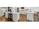 Gourmet kitchen featuring a large center island with white cabinets and countertops at 1806 Asbury Hall Ct, Charlotte, NC 28209