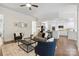 Open-concept living room and kitchen featuring hardwood floors at 1806 Asbury Hall Ct, Charlotte, NC 28209