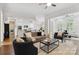 Open-concept living room next to the kitchen features hardwood floors at 1806 Asbury Hall Ct, Charlotte, NC 28209