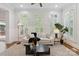 Bright living room featuring plantation shutters on the windows and modern decor at 1806 Asbury Hall Ct, Charlotte, NC 28209