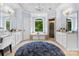 Bright main bathroom with white cabinetry, a large tub, and a glass-enclosed shower at 1806 Asbury Hall Ct, Charlotte, NC 28209