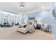Spacious main bedroom featuring a tray ceiling and adjoining sitting area with abundant natural light at 1806 Asbury Hall Ct, Charlotte, NC 28209