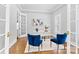 Office with hardwood floors, white walls, and French doors to the bathroom at 1806 Asbury Hall Ct, Charlotte, NC 28209