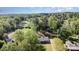 An aerial view showcasing the property nestled amongst mature trees at 205 Timberfield Trl, China Grove, NC 28023