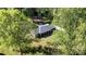 Aerial view of home showcasing a well-kept lawn, and mature trees at 205 Timberfield Trl, China Grove, NC 28023