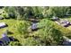 Aerial view of home showcasing well-maintained lawn and wooded area at 205 Timberfield Trl, China Grove, NC 28023