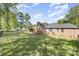 Well maintained and landscaped backyard, fully fenced with brick house at 205 Timberfield Trl, China Grove, NC 28023