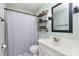 Bathroom with a white vanity, open shelving, modern fixtures and a shower at 205 Timberfield Trl, China Grove, NC 28023