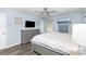 Comfortable bedroom featuring light blue walls, gray dresser, and a ceiling fan at 205 Timberfield Trl, China Grove, NC 28023