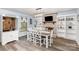 Bright dining room featuring a dining table, built-in shelves, and a charming fireplace at 205 Timberfield Trl, China Grove, NC 28023