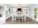 Bright dining room featuring a dining table, built-in shelves, and a charming fireplace at 205 Timberfield Trl, China Grove, NC 28023