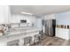 Well-lit kitchen offers an island with seating, stainless steel appliances, and a convenient layout at 205 Timberfield Trl, China Grove, NC 28023