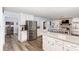 Spacious kitchen area flows into an adjacent dining space, complete with modern stainless steel appliances at 205 Timberfield Trl, China Grove, NC 28023