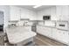The kitchen has an island, stainless steel appliances, and generous counter space and storage at 205 Timberfield Trl, China Grove, NC 28023