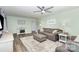 Inviting living room with a large sectional sofa, TV, and stylish decor at 205 Timberfield Trl, China Grove, NC 28023